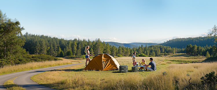 Family using AFERIY P210 to power campsite lights and cooking equipment for PC